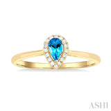 5x3 MM Pear Shape Blue Topaz and 1/20 Ctw Single Cut Diamond Halo Semi-Precious Ring in 10K Yellow Gold