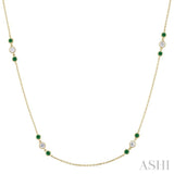 2.25 MM Emerald and 1/2 Ctw Round Cut Diamond Precious Station Necklace in 14K Yellow Gold